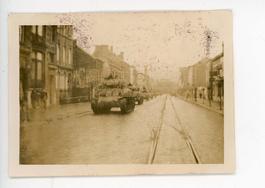 View of tanks moving through Belgium during the Battle of the Bulge