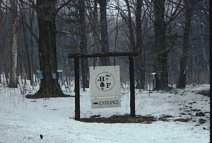 Hopkins Memorial Forest entrance sign in winter.