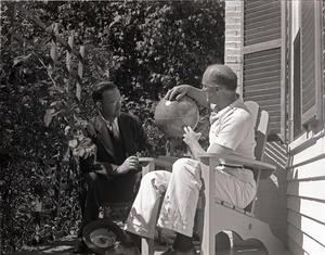 Richard Hallet: Hallet and unidentified man seated on a porch, looking at a globe