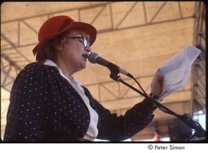 MUSE concert and rally: Bella Abzug in red hat speaking at the No Nukes rally