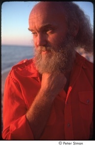 Ram Dass, half-length portrait on beach