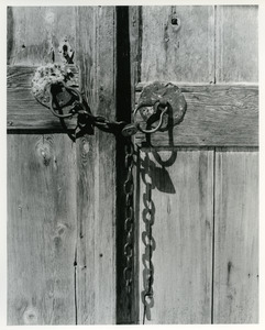 Wooden door with lock and chain