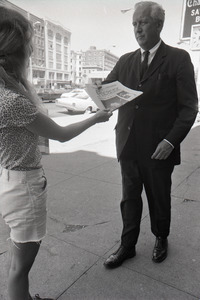 Boston Phoenix promotional photos: Phoenix hawker handing paper to man