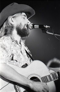 New Riders of the Purple Sage opening for the Grateful Dead at Sargent Gym, Boston University: John 'Marmaduke' Dawson playing acoustic guitar and signing