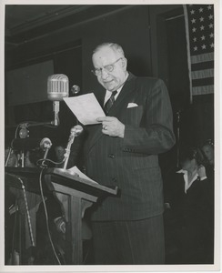 Colonel John N. Smith speaking on stage at Institute Day