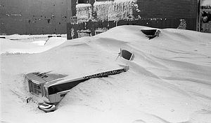 Police vehicles under snowdrifts