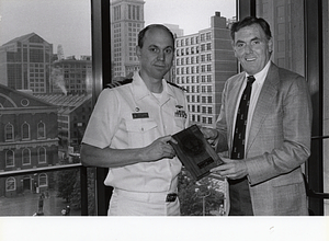 Commander William J. Riffer presenting plaque from Nuclear Attack Submarine USS Boston to Mayor Raymond L. Flynn