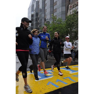 Runners crossing finish line at "One Run" event in Boston (May 2013)