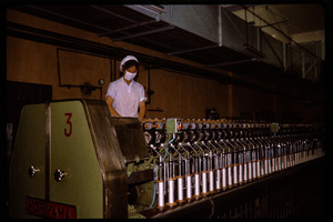 Cotton mill: operator at a textile machine