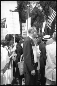 Priest among a crowd of protesters at a civil rights and fair housing demonstration in front of the White House
