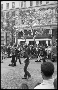 Street theater at the Vietnam Moratorium in New York: mimes in a gun fight