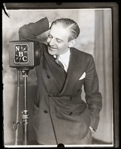 Walter Winchell with an NBC radio microphone during the Bruno Richard Hauptmann trial