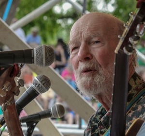 Pete Seeger singing and playing banjo at the Clearwater Festival