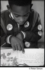 Boy reading at his desk, Liberation School, Boston, Mass.