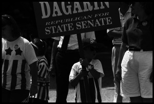 Child holding a sign 'Dagarin Republican for State Senate' at Chesterfield's Fourth of July parade