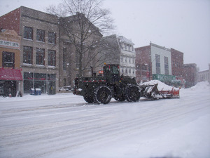 Snow plow at work clearing Main Street, Northampton, Mass.