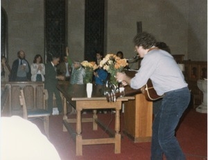 Lorre Wyatt playing guitar at the Margaret Holt dinner, First Congregational Church, Amherst