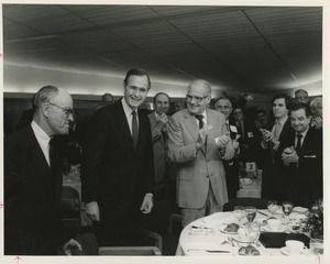 Audience applauding Jeremiah Milbank, Jr. and vice president George Bush at an ICD conference