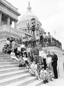 Congressman John W. Olver (right) with unidentified group on the steps of the United States Capitol building