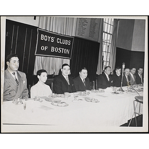 Officers and guests seated at the head table, including Senator John E. Powers, seated fourth from left