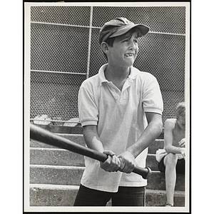 A boy holds a bat