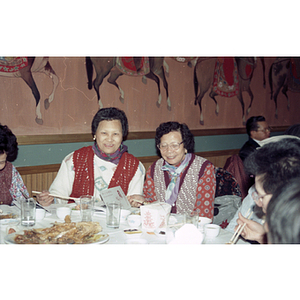 Guests enjoy food at a Chinese New Year celebration hosted by the Chinese Progressive Association