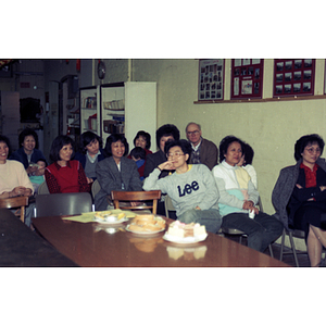 Audience and refreshments at a meeting between Mexican workers and the Chinese Progressive Association