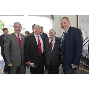 President Joseph E. Aoun and Dr. George J. Kostas pose with two men at the groundbreaking ceremony