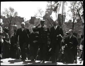 Welcome home ceremony for Richard Byrd at the Massachusetts State House following his Antarctic Expedition: Admiral Byrd arriving, arm in arm with Gov. James Michael Curley