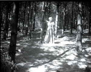 Dorothy Canfield Fisher standing in the woods