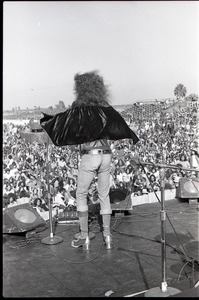 Hollywood Speedway Rock Festival: Wet Willie in performance, Jimmy Hall (vocals) at edge of stage wearing cape