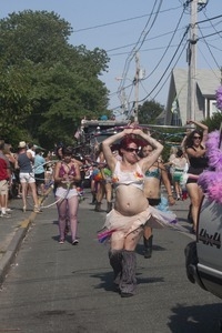 Parade marchers wielding hula hoops : Provincetown Carnival parade