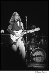 T-Bone Burnett playing Rickenbacker guitar on stage at the Harvard Square Theater, Cambridge, with the Rolling Thunder Revue