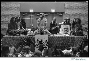 Ram Dass and associates on stage during an appearance at the College of Marin