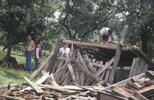 Halpern with villagers and old shed