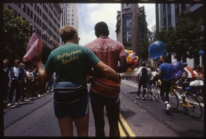 Men walking arm in arm at the San Francisco Pride Parade