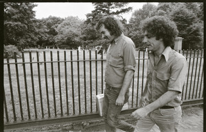 Abbie Hoffman and George Kimball walking past a cemetery (Garden Street side of Old Burying Ground)