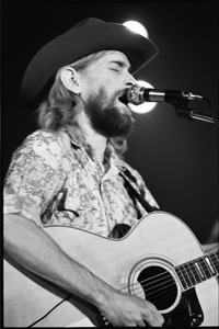 New Riders of the Purple Sage opening for the Grateful Dead at Sargent Gym, Boston University: John 'Marmaduke' Dawson playing acoustic guitar and signing