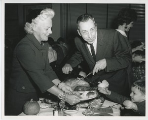 Margaret Milbank Bogert and Mr. Burrows putting together a plate for a client at Thanksgiving celebration