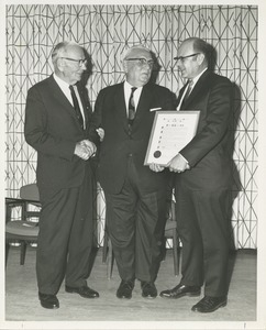 Dr. George G. Deaver and Dr. DiMichael presenting Dr. Frank Krusen with an award