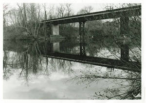 Reflection of railroad bridge over Lake Massasoit