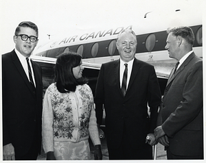 Mayor John F. Collins with his daughter and American and Canadian government officials in front of a plane in Saint John.