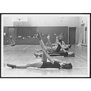 Adults stretching in gym at Hyde Park branch
