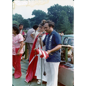 A man speaks into a microphone at the Festival Puertorriqueño