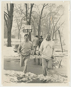 Vernon Cox and Jack Costello running in the snow