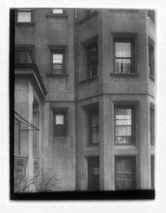 View of three floors of windows and a drainpipe, probably Hotel Somerset