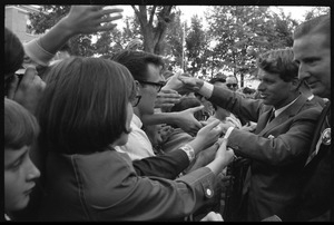 Robert F. Kennedy shaking hands with the crowd after stumping for Democratic candidates