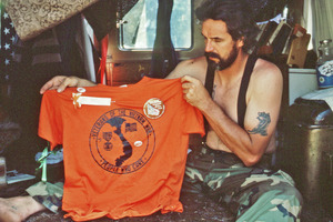 Gene Dorr holding an orange shirt