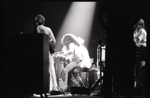 Santana concert at the Springfield Civic Center: Carlos Santana (back to camera) playing to the band