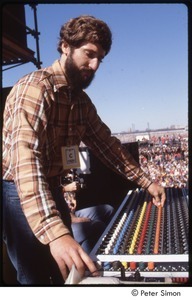 MUSE concert and rally: man at sound board during No Nukes rally